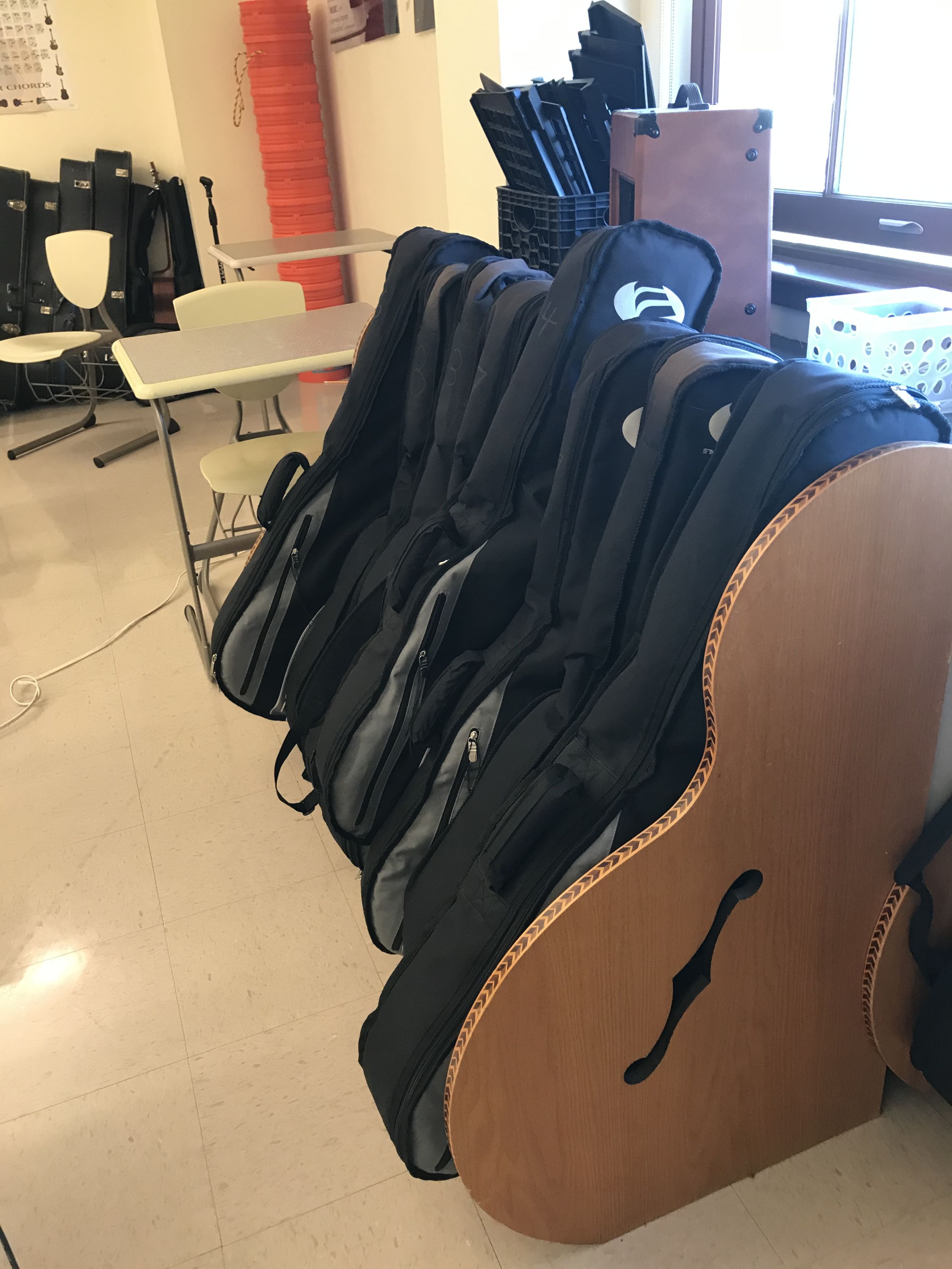 Classroom guitars await the return of students.